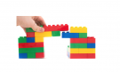 hand building a colorful bridge made out of toy blocks